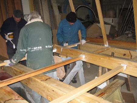 Sail-bars being fitted