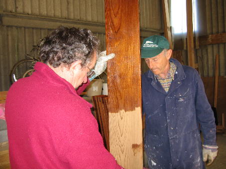 Fred and Colin painting preservative onto the shutters