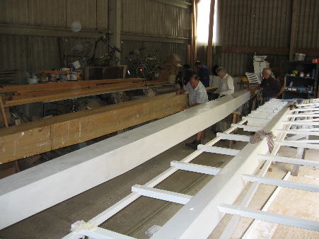 One stock painted and the other being planed