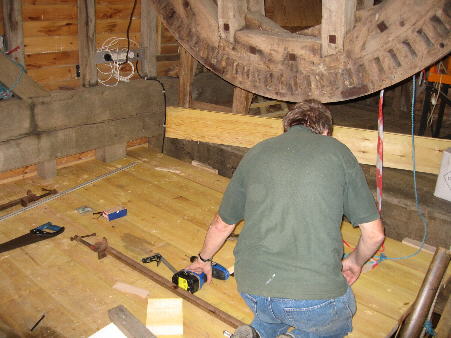 Keith laying floor-boards to Stone Floor