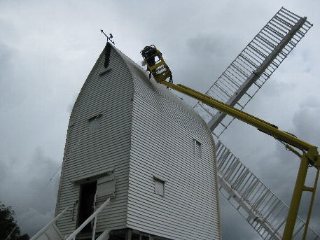 Using Plumpton College's cherry picker to paint the roof