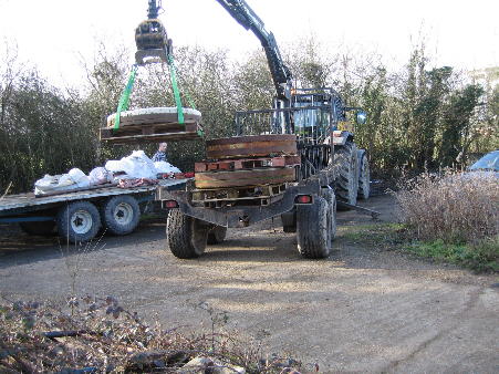 Re-banded millstones being delivered to the Barn by Plumpton College.