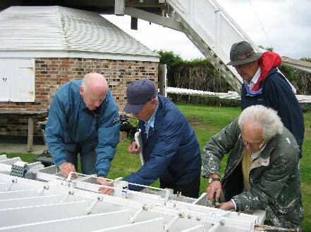 Fred, Roy and Peter hard at fitting out a sweep