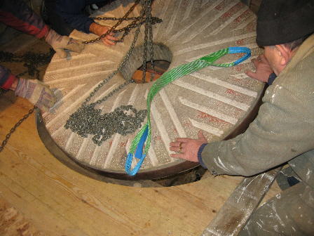 Bed stone being lowered into position