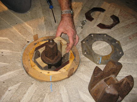 Holly bearing for shaft supporting the runner stone, bottom right is the mace which sits on the shaft and is driven by the quant