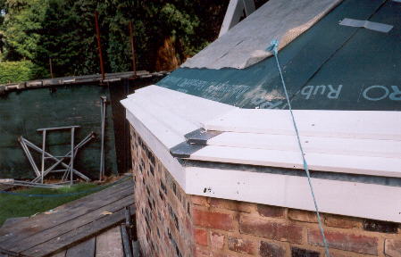 The round house roof is nearly completely  weatherboarded